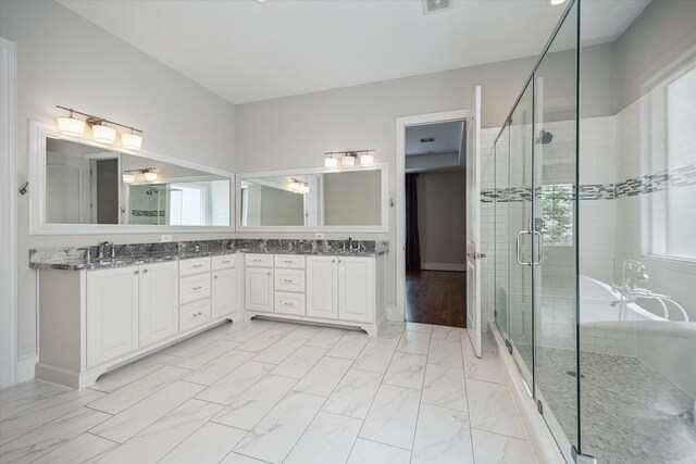 3310 Glen Haven Blvd, Houston, TX 77025 - bathroom with a stall shower, marble finish floors, and double vanity