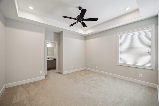 3310 Glen Haven Blvd, Houston, TX 77025 - empty room with a raised ceiling, light colored carpet, recessed lighting, and ceiling fan