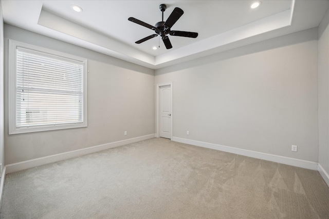 3310 Glen Haven Blvd, Houston, TX 77025 - unfurnished room with a tray ceiling, recessed lighting, light carpet, and ceiling fan
