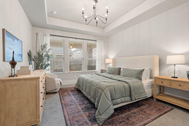 6023 Dovetail Cliff Ct, Katy, TX 77493 - carpeted bedroom with a chandelier and a raised ceiling