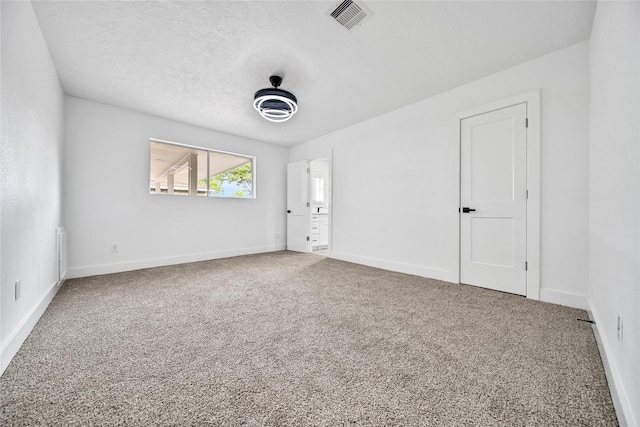 9622 Clanton St, Houston, TX 77080 - empty room with carpet flooring, radiator heating unit, and a textured ceiling