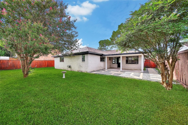 9622 Clanton St, Houston, TX 77080 - rear view of property featuring a patio area, a fenced backyard, and brick siding