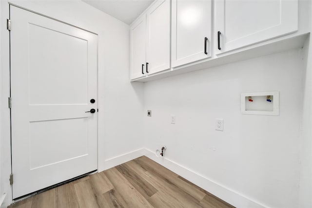9622 Clanton St, Houston, TX 77080 - laundry room featuring cabinet space, hookup for an electric dryer, light wood finished floors, hookup for a washing machine, and hookup for a gas dryer