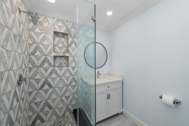 9210 Rangely Dr, Houston, TX 77055 - bathroom featuring vanity, a stall shower, crown molding, and recessed lighting