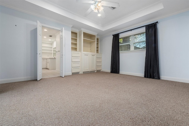9210 Rangely Dr, Houston, TX 77055 - unfurnished bedroom featuring crown molding, light colored carpet, a tray ceiling, ceiling fan, and recessed lighting