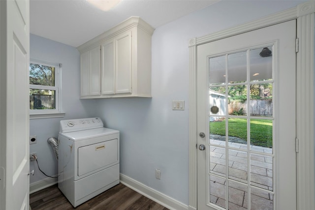 9210 Rangely Dr, Houston, TX 77055 - laundry room with washer / clothes dryer, cabinet space, and dark wood-style flooring
