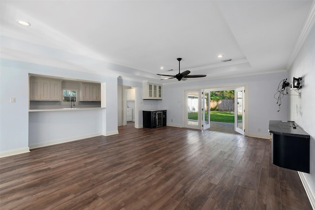 9210 Rangely Dr, Houston, TX 77055 - unfurnished living room featuring a tray ceiling, dark wood-style floors, ceiling fan, recessed lighting, and crown molding