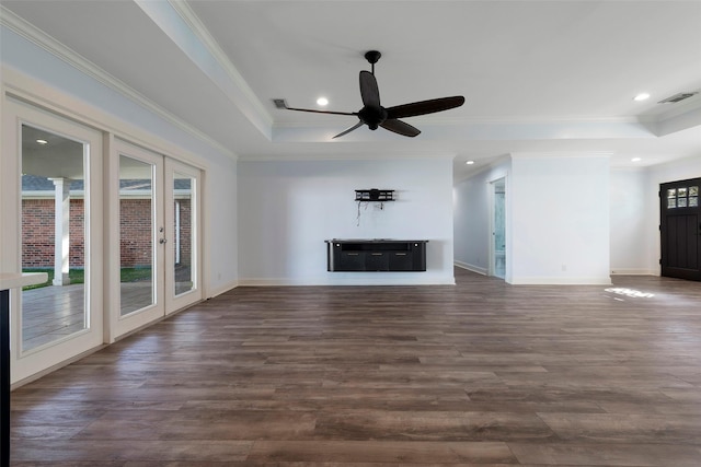 9210 Rangely Dr, Houston, TX 77055 - unfurnished living room featuring a tray ceiling, crown molding, dark wood finished floors, french doors, and a ceiling fan