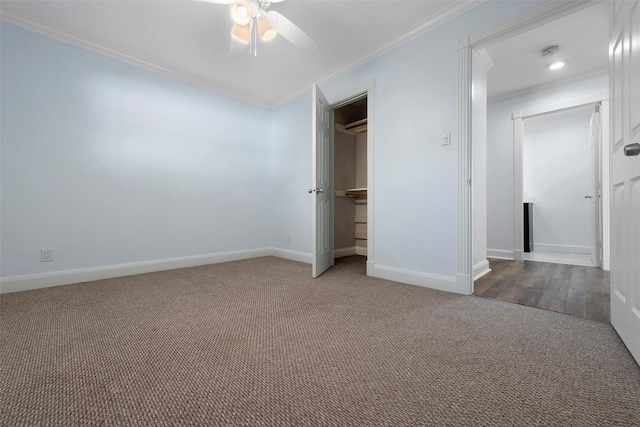 9210 Rangely Dr, Houston, TX 77055 - unfurnished bedroom featuring carpet flooring, crown molding, a ceiling fan, and a closet