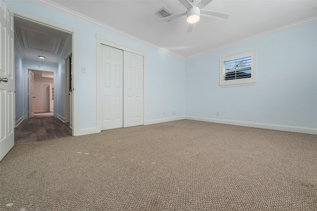 9210 Rangely Dr, Houston, TX 77055 - unfurnished bedroom featuring attic access, carpet floors, a closet, crown molding, and a ceiling fan