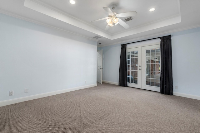 9210 Rangely Dr, Houston, TX 77055 - carpeted spare room with a tray ceiling, french doors, crown molding, ceiling fan, and recessed lighting