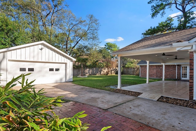 9210 Rangely Dr, Houston, TX 77055 - view of yard with a ceiling fan, an outbuilding, and a detached garage