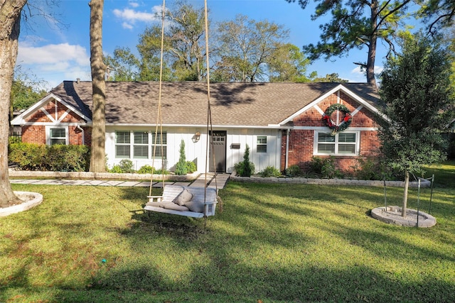 9210 Rangely Dr, Houston, TX 77055 - view of front of house featuring brick siding, a front lawn, and a shingled roof