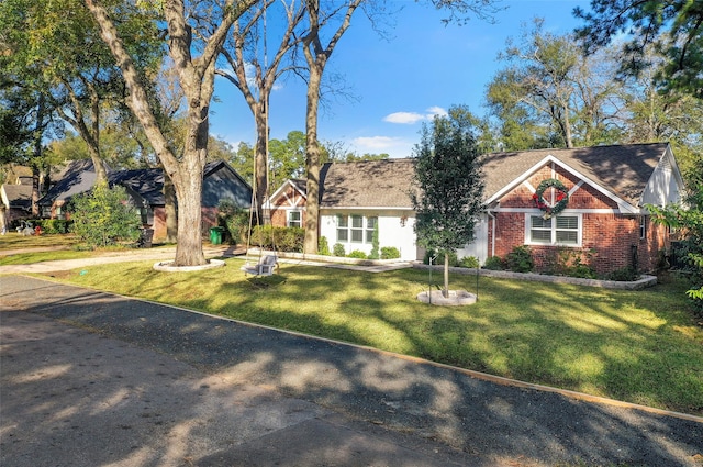 9210 Rangely Dr, Houston, TX 77055 - view of front of home featuring brick siding and a front yard