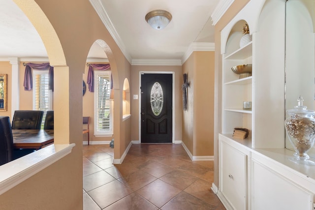 2902 Rainwood St, Spring, TX 77388 - entrance foyer with arched walkways, crown molding, and light tile patterned flooring