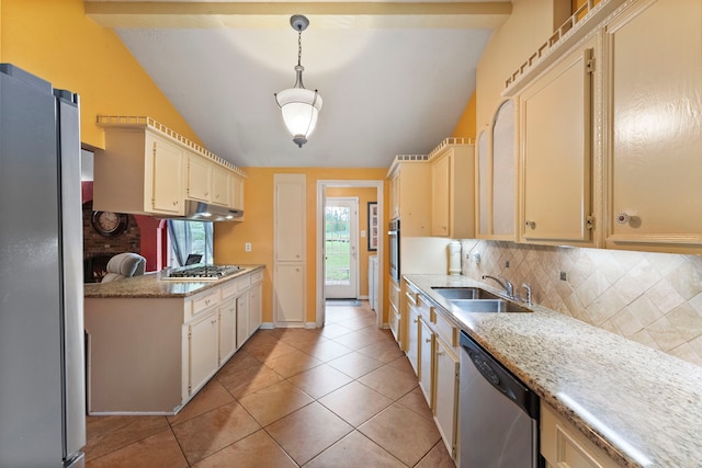 2902 Rainwood St, Spring, TX 77388 - kitchen featuring appliances with stainless steel finishes, decorative backsplash, lofted ceiling, light tile patterned floors, and under cabinet range hood