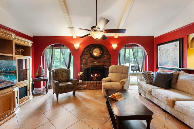 2902 Rainwood St, Spring, TX 77388 - living area with light tile patterned floors, a brick fireplace, and ceiling fan