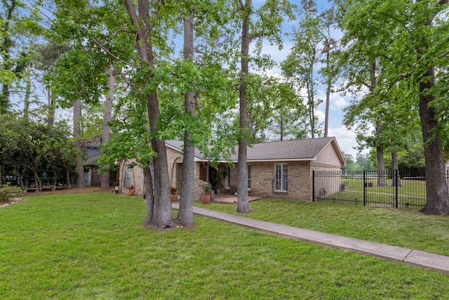 2902 Rainwood St, Spring, TX 77388 - view of front facade with brick siding and a shingled roof