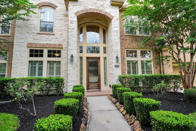 13723 Playa Lucia Ct, Houston, TX 77044 - doorway to property featuring stone siding