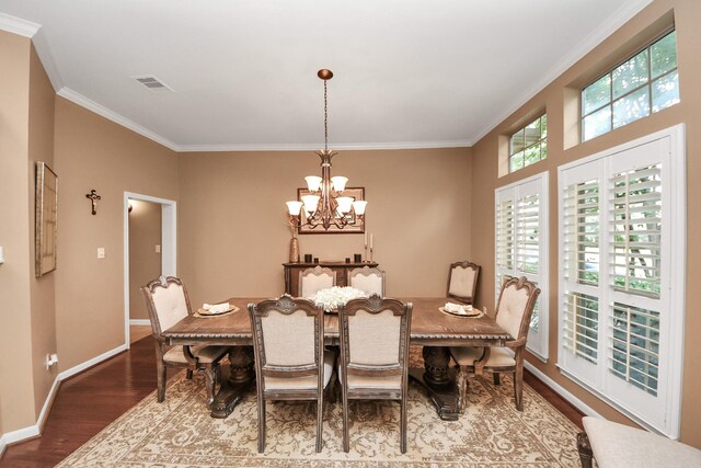 13723 Playa Lucia Ct, Houston, TX 77044 - dining space with ornamental molding, wood finished floors, and a chandelier