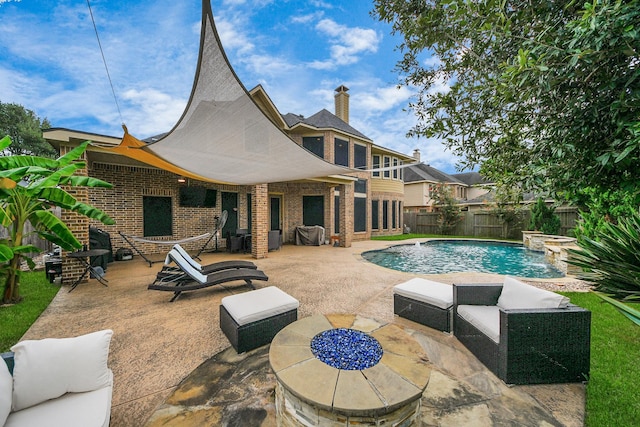 13723 Playa Lucia Ct, Houston, TX 77044 - view of swimming pool featuring a patio area, a fenced backyard, and a pool with connected hot tub