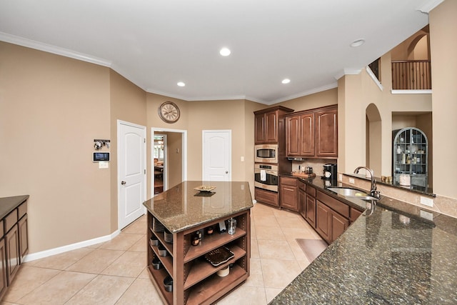 13723 Playa Lucia Ct, Houston, TX 77044 - kitchen with open shelves, appliances with stainless steel finishes, arched walkways, light tile patterned floors, and recessed lighting