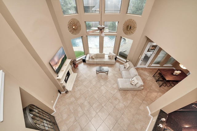 13723 Playa Lucia Ct, Houston, TX 77044 - living area featuring a towering ceiling and ceiling fan