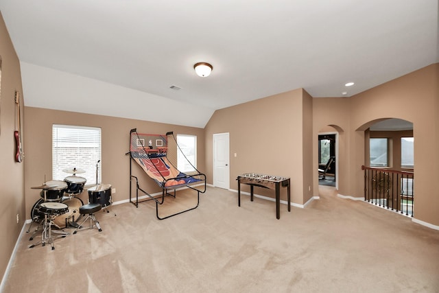 13723 Playa Lucia Ct, Houston, TX 77044 - game room featuring carpet floors, arched walkways, healthy amount of natural light, and lofted ceiling