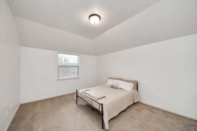 13723 Playa Lucia Ct, Houston, TX 77044 - bedroom featuring light colored carpet and vaulted ceiling
