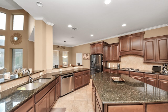 13723 Playa Lucia Ct, Houston, TX 77044 - kitchen featuring appliances with stainless steel finishes, decorative backsplash, plenty of natural light, recessed lighting, and dark stone countertops