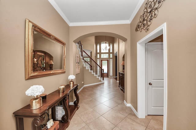 13723 Playa Lucia Ct, Houston, TX 77044 - entrance foyer featuring arched walkways, light tile patterned floors, and ornamental molding