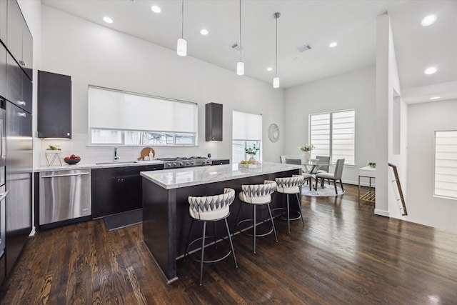 805 Sandman St, Houston, TX 77007 - kitchen with dishwasher, a center island, a kitchen breakfast bar, dark wood-type flooring, and modern cabinets