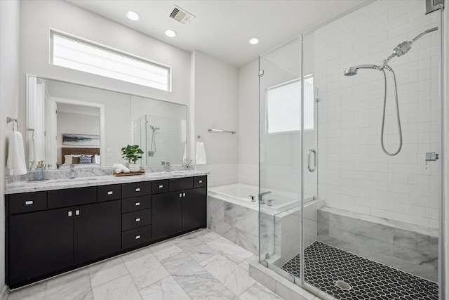 805 Sandman St, Houston, TX 77007 - full bathroom with a shower stall, a garden tub, double vanity, marble look tile flooring, and recessed lighting