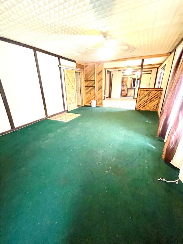 206 E Rogers St, Ganado, TX 77962 - unfurnished living room with carpet flooring