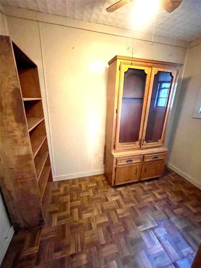 206 E Rogers St, Ganado, TX 77962 - interior space featuring baseboards and ceiling fan