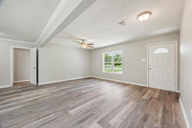 210 Laurel St, Lake Jackson, TX 77566 - foyer with a textured ceiling, ceiling fan, and wood finished floors