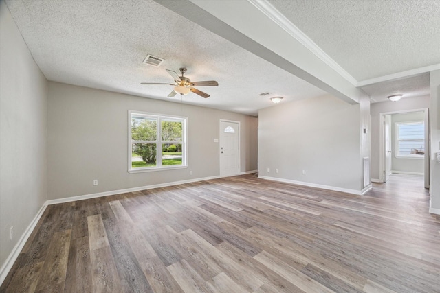 210 Laurel St, Lake Jackson, TX 77566 - unfurnished room featuring a textured ceiling, a ceiling fan, and wood finished floors