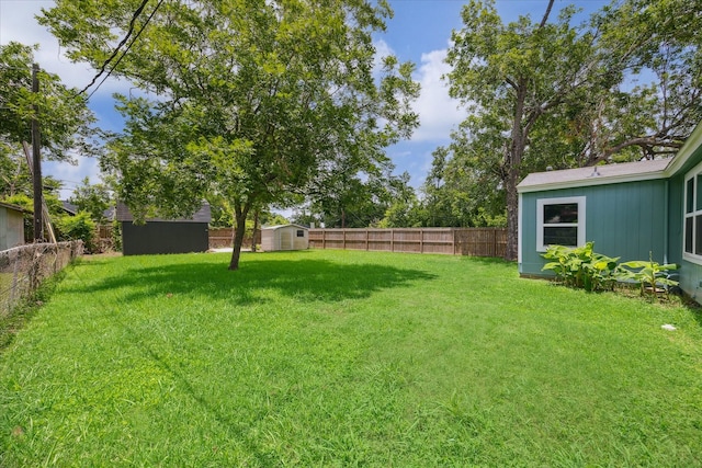210 Laurel St, Lake Jackson, TX 77566 - fenced backyard with a storage shed