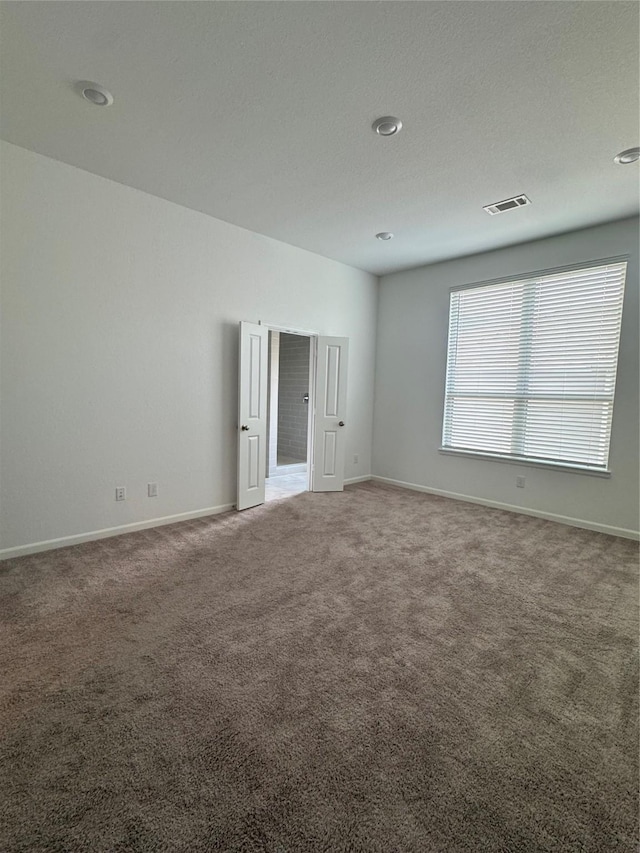 214 Fulton Station Dr, Houston, TX 77009 - carpeted empty room with recessed lighting