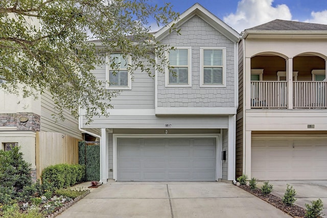 1113 Peden St Unit A, Houston, TX 77006 - view of property featuring a garage and driveway