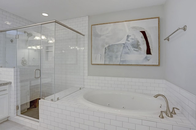 1113 Peden St Unit A, Houston, TX 77006 - full bathroom with a shower stall, a whirlpool tub, and vanity