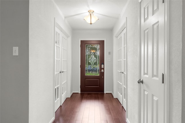 18910 Casper Dr, Spring, TX 77373 - foyer entrance featuring dark wood-style flooring and baseboards