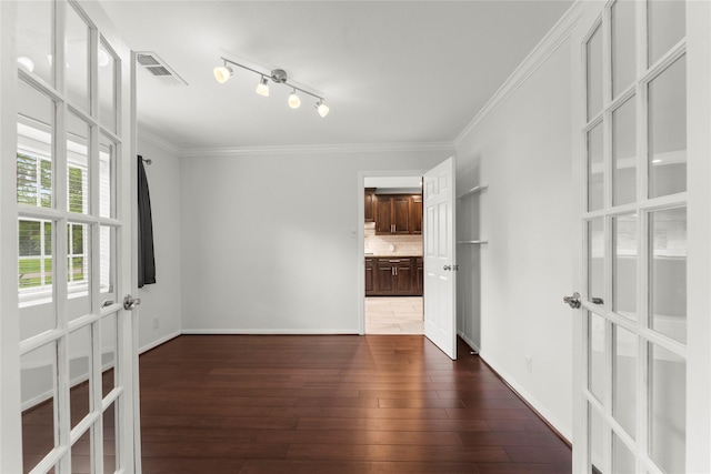 18910 Casper Dr, Spring, TX 77373 - unfurnished room with wood-type flooring, crown molding, and french doors