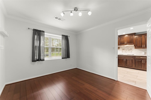 18910 Casper Dr, Spring, TX 77373 - empty room featuring light wood-type flooring and crown molding