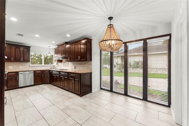 18910 Casper Dr, Spring, TX 77373 - kitchen with stainless steel appliances, a chandelier, decorative backsplash, dark brown cabinetry, and recessed lighting