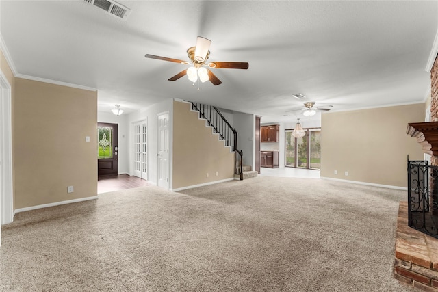 18910 Casper Dr, Spring, TX 77373 - unfurnished living room with ceiling fan, a brick fireplace, carpet flooring, stairs, and ornamental molding
