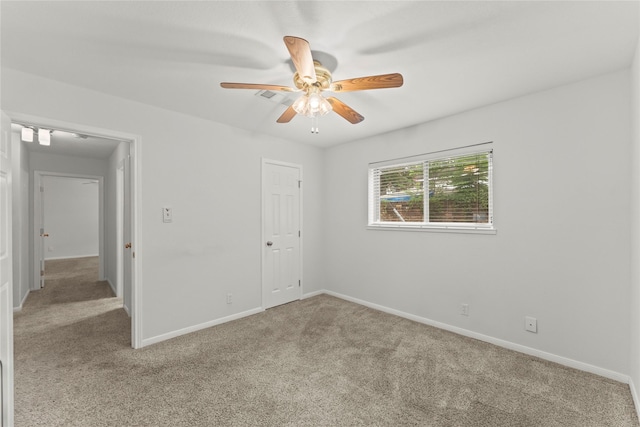 18910 Casper Dr, Spring, TX 77373 - unfurnished bedroom with light carpet and a ceiling fan