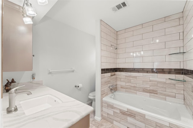 18910 Casper Dr, Spring, TX 77373 - bathroom featuring vanity, tiled shower / bath, and tile patterned floors