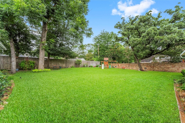 18910 Casper Dr, Spring, TX 77373 - fenced backyard featuring a playground