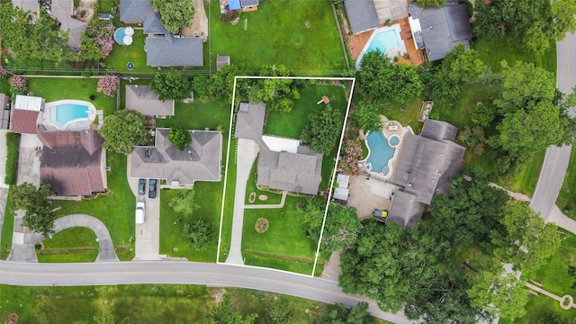 18910 Casper Dr, Spring, TX 77373 - aerial perspective of suburban area with a pool area and property boundaries highlighted